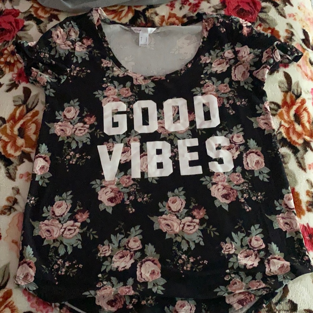 This is a graphic tee with a floral print